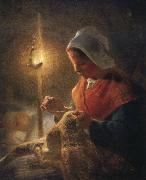 Woman sewing by lamplight
